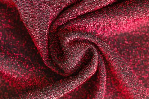 Shiny surface of red and black fabric with lurex Stock Photos