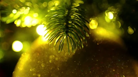 Shiny tree ornament and pine branches, beautiful bokeh lights Stock Footage 322962860