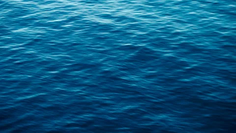 Shiny wave reflections of the sun in the water. It's a close-up shot of the ocea Stock Footage 146336952