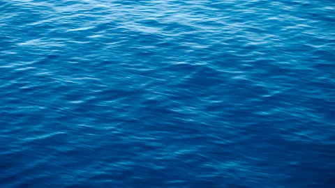 Shiny wave reflections of the sun in the water. It's a close-up shot of the ocea Stock Footage 147979338