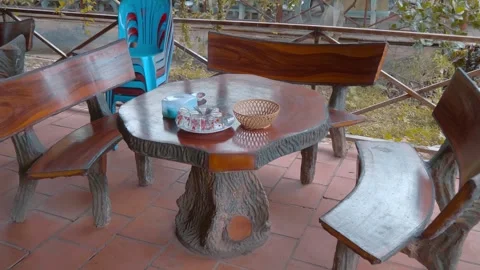 Shiny well polished table and benches made from solid mango tree wood Stock Footage 333312158