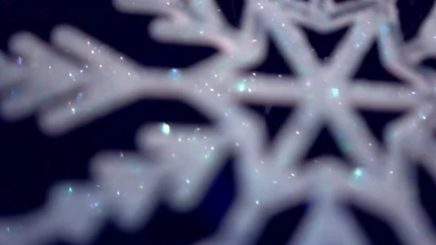 Shiny white artificial snowflake decorated with glitter powder, close-up 스톡 동영상 99148915