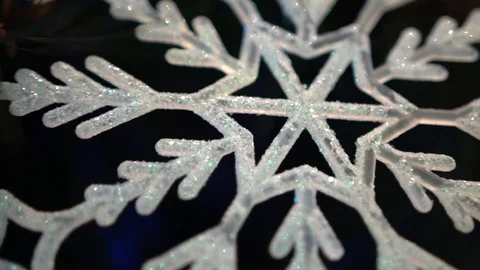 Shiny white artificial snowflake decorated with glitter powder, close-up 스톡 동영상 99148917