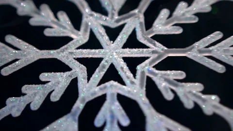 Shiny white artificial snowflake decorated with glitter powder, close-up 스톡 동영상 99148929