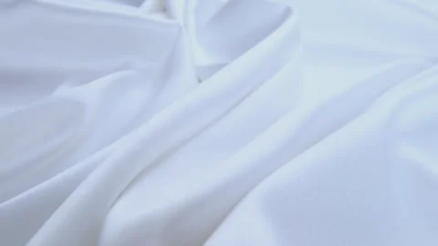 Shiny white flowing cloth texture shot in close up view macro shot. Wavy clean s Stock Footage 277437760