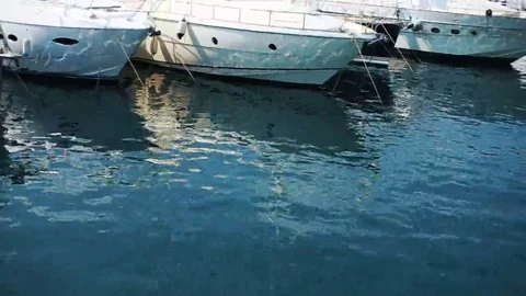 Shiny white yachts float on the sea Stock Footage 69161525