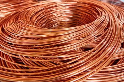 Shiny winded copper cable in warehouse of production plant Stock Photos