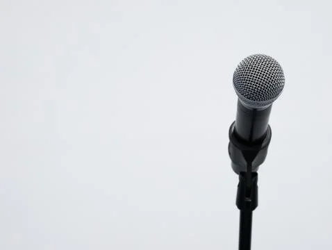 Shiny wireless microphone on stand Stock Photos
