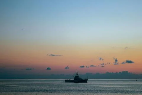 Ship against the dawn sky Stock Photos