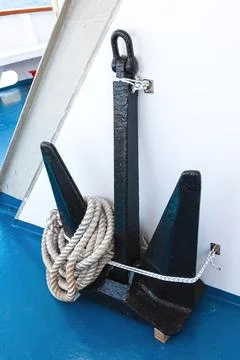 Ship anchor with rope on the deck of the ship Stock Photos