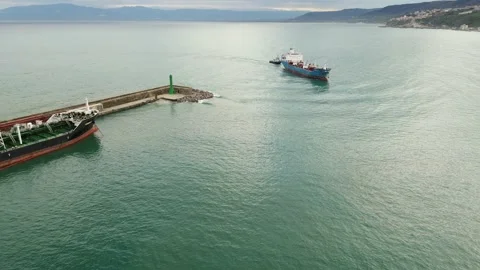 Ship and tug working together Stock Footage 238363984