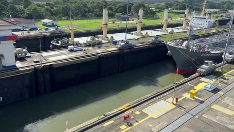 Ship being pulled by locomatives through Gatun Locks, Panama Canal Video stock 169078257