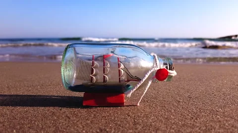 A Ship in a Bottle on the Beach Stock Footage 163186770
