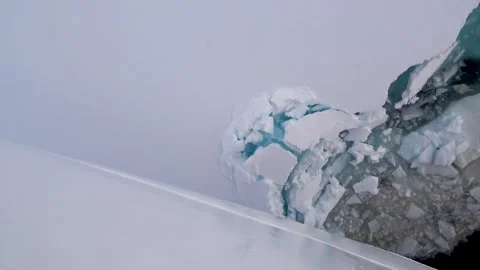 Ship bow crushing through sea ice close-up Antarctica, 4K Stock Footage 332399092