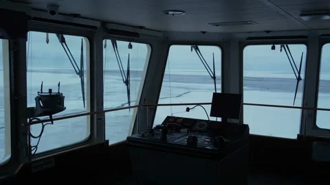 Ship bridge. View on control panel on wing and frozen sea outside. Vessel in ice Stock Footage 218604856