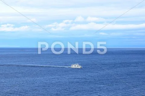 Ship in the calm blue sea Stock Photos