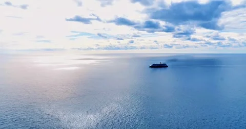 Ship on calm ocean under partly cloudy sky. Stock Footage 314224103