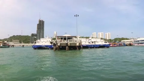 A ship with a camera is sailing along the sea pier with passenger ships. Stock Footage 130903783