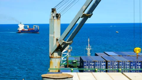 Ship cargo crane load containers and one ship entering to the port Stock Footage 155014331
