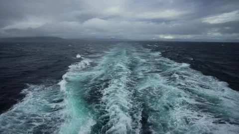 The ship charges through the ocean, the wind sweeping over the waves and Stock Footage 251422305