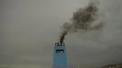 Ship Chimney Emitting Black Smoke Against Grey Overcast Sky 動画素材 336424067