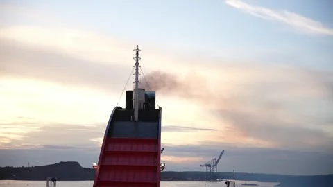 Ship chimney smoking while heading into the sea Stock Footage 294205964