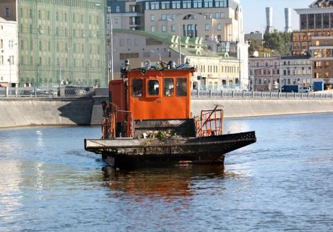 The ship clears the river of debris Stock Photos