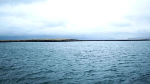 Ship coming back from ocean Cloudy sky Island in the background Stock Footage 89545581