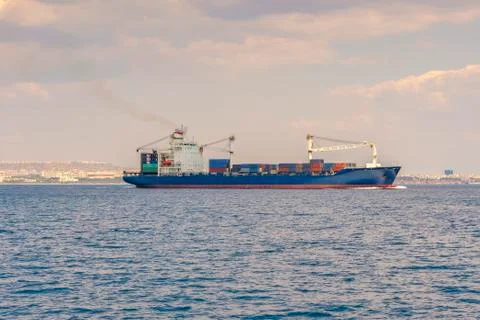 The ship is a container ship sailing along the sea, against the background of Stock-Fotos