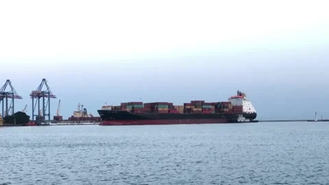 Ship with containers in the sea port. unloading a ship with containers Stock-Footage 197547038