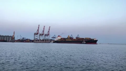 Ship with containers in the sea port. unloading a ship with containers Video stock 197547063