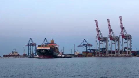 Ship with containers in the sea port. unloading a ship with containers Video stock 199095363