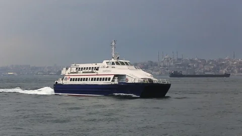 The ship crosses the Bosphorus on the background of the Blue Mosque Stock Footage