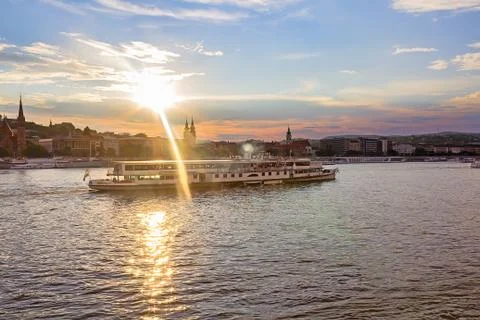 Ship on the Danube River in Budapest Hungary in the rays of the sun Stock Photos