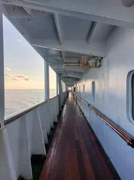 Ship Deck Corridor Overlooking Calm Sea on a Sunny Day. Stock Photos