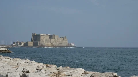 Ship disappears behind the Egg Castle, Naples, Italy Stock Footage 112673370