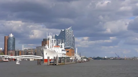 A ship is docked in the city harbor Stock Footage 312536809