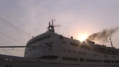 The ship docked at the port under the sunset Stock Footage 276516955