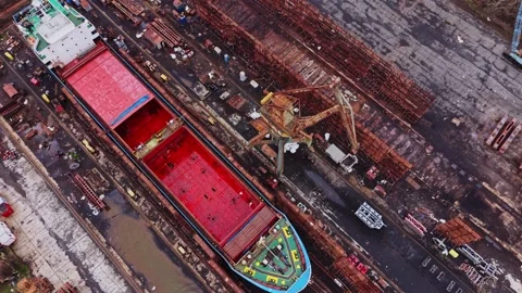 Ship docked at shipyard for cargo loading and unloading tasks Stock Footage 337941360