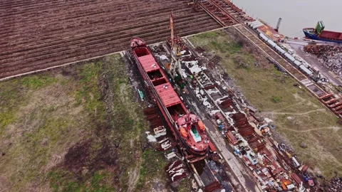 Ship docked in shipyard for maintenance and cargo handling Stock Footage 337942865