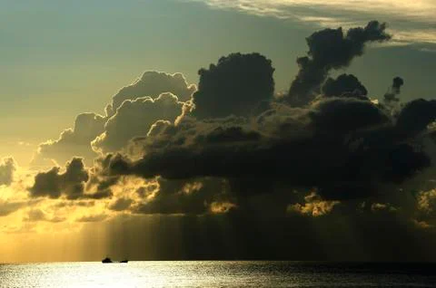 Ship in dramatic cloud atmosphere Liparic or Aeolian Islands Sicily Italy Europe Stock Photos