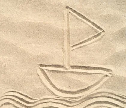 A ship drawn on the sand. Texture of sea sand background closeup with ornament Stock Photos