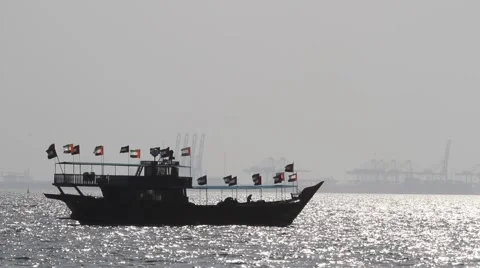 Ship in Dubai Marina with UAE flags Stock Footage 44456137