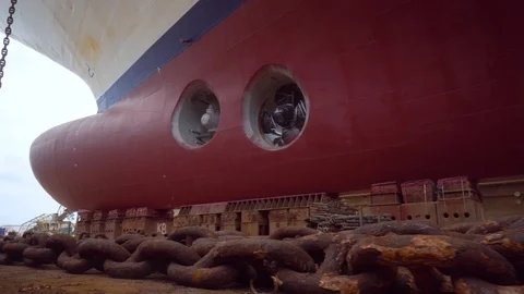 Ship during a drydock renovation with a huge rusty anchor chain Stock Footage 105804976