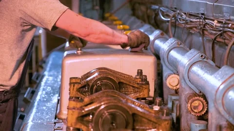 The ship engineer uncovers the engine. Stock Footage 142685957
