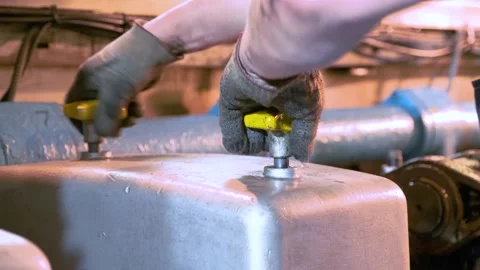 The ship engineer uncovers the engine. Stock Footage 142686034