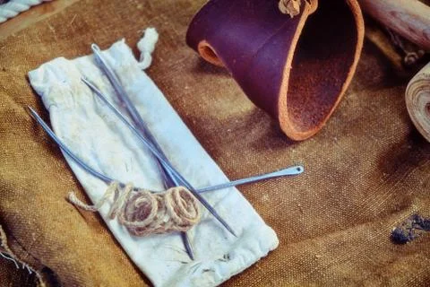 Ship equipment for the needs of sailors on deck.Large thread with needles, le Stock Photos