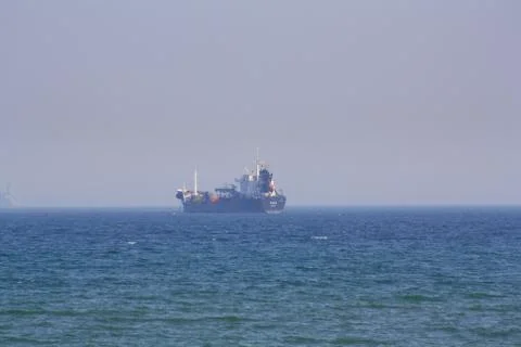 A ship far in the sea. Stock Photos