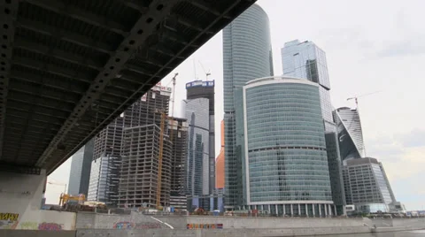Ship float under bridge and constructed office skyscrapers on the river. Moscow Stock Footage 39667257