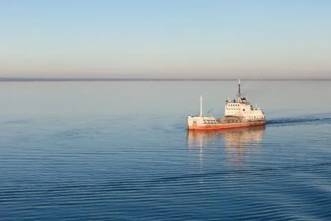 The ship floating by sea Stock Photos